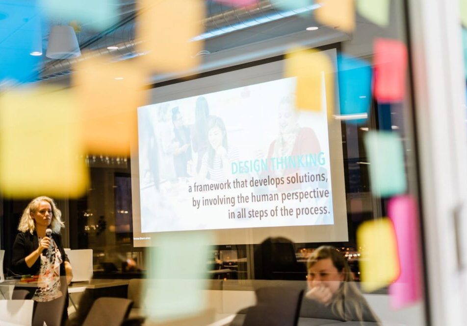 view of a large monitor in a glass conference room