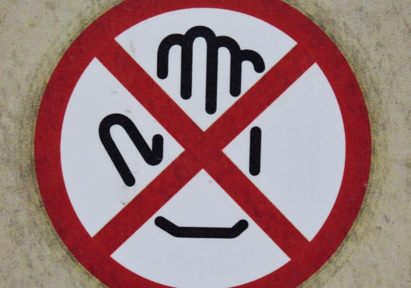 Hand icon in a red circle with a red X across it.