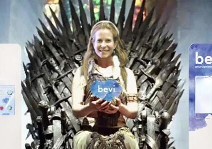 Eliza Becton, co-founder of Bevi photoshopped to look like a queen holding an award, surrounded by stand-up Bevi machines