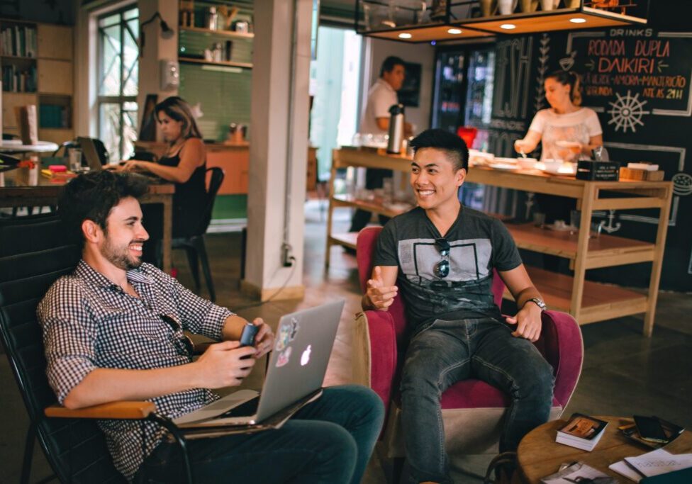 Two men smiling in an office