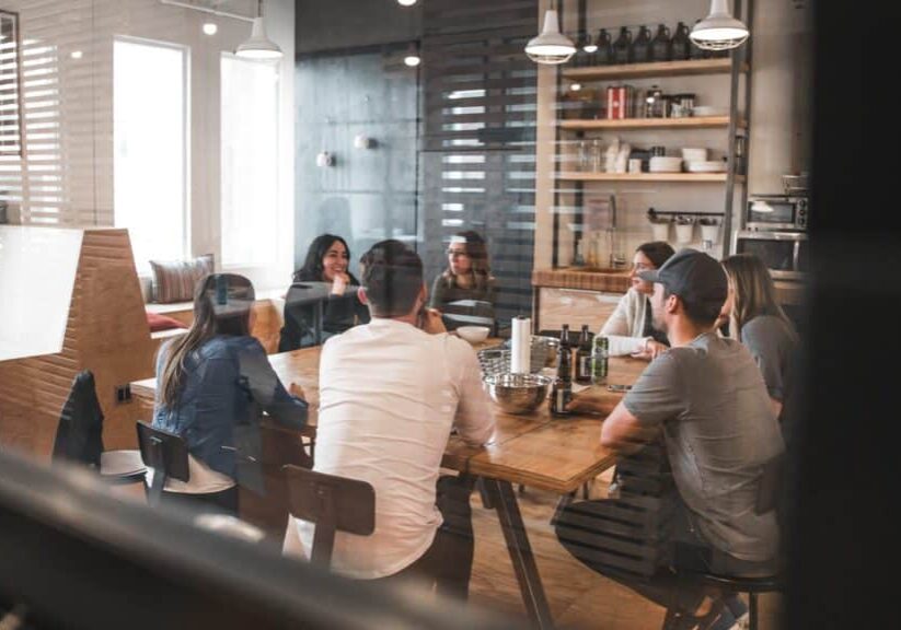 Group of people enjoying drinks in the company kitchen