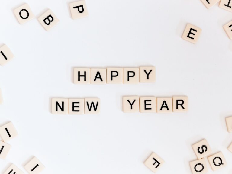 Scrabble pieces spelling out "Happy New Year"