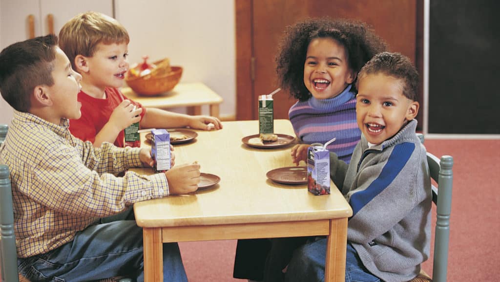 preschoolers drinking juice