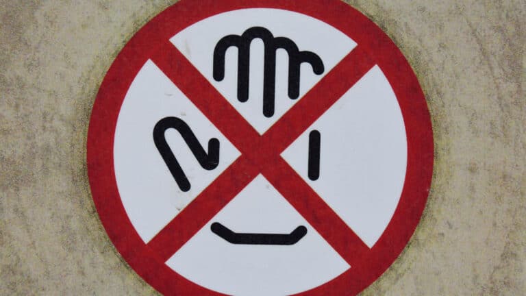 Hand icon in a red circle with a red X across it.